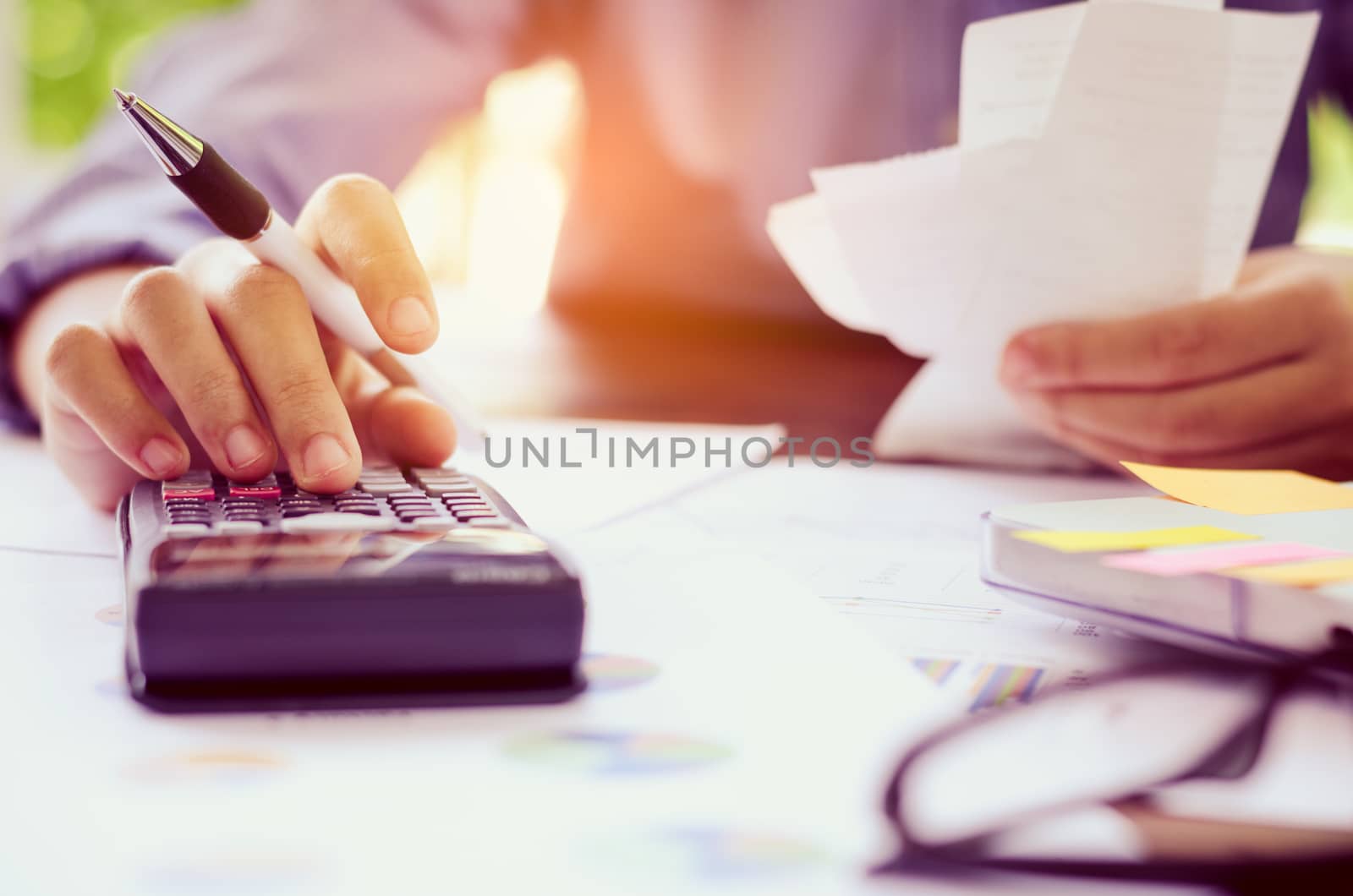 Businessman are working with a calculator and laptop. in office business concept 