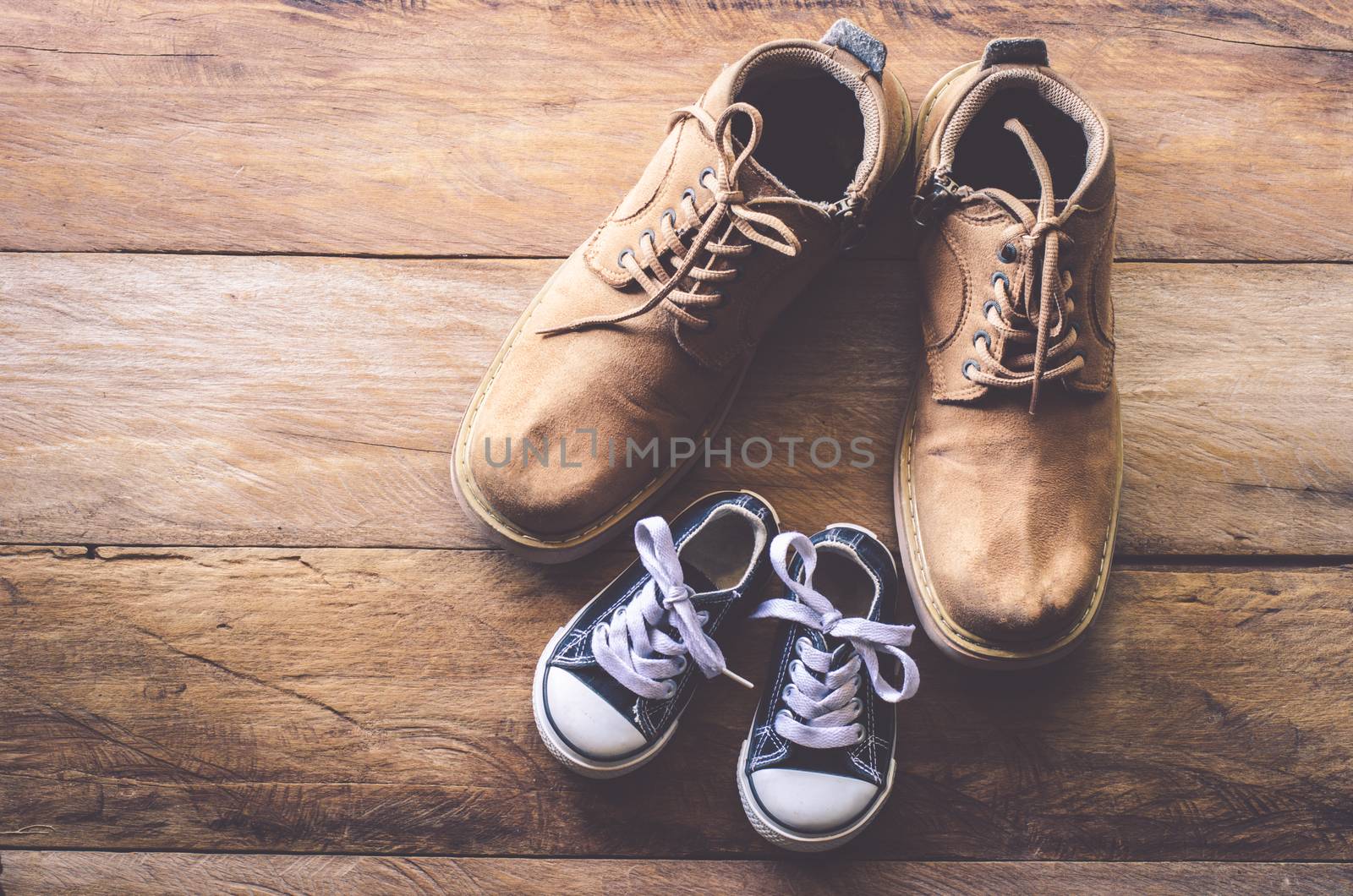 The shoes of father and son - concept takecare