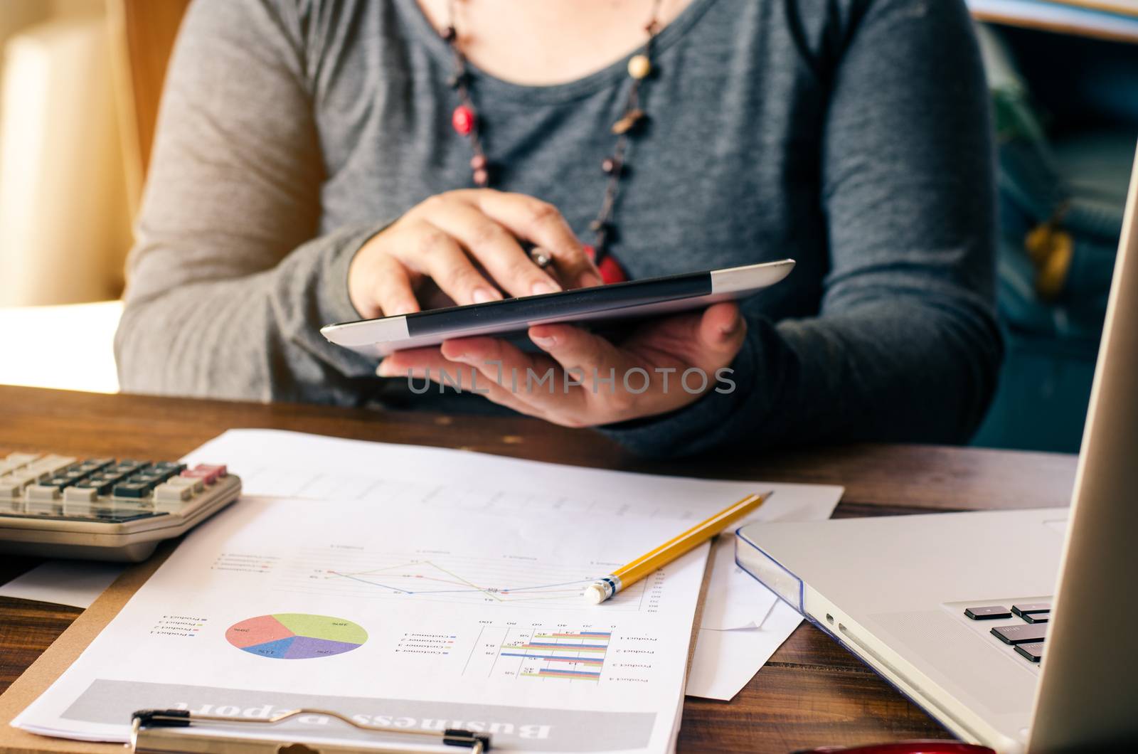 Working on a desk numerical analysis, financial accounting. Graphing on smartphone