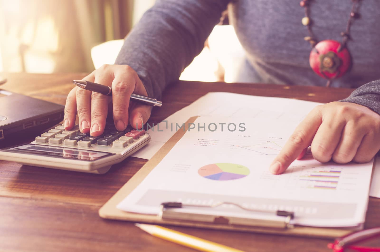 Businessman are working with a calculator and laptop. in office business concept 