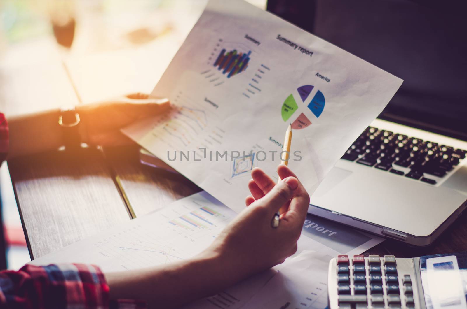 Working on a desk numerical analysis, financial accounting. Graphing 
