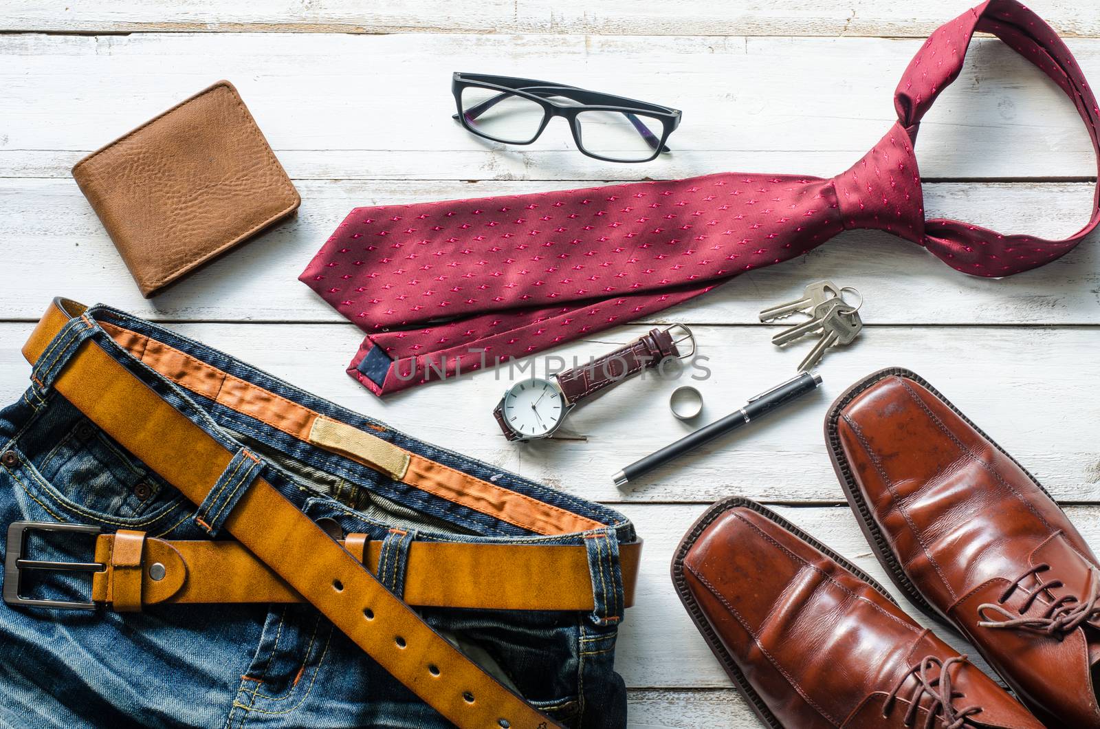 Clothing and accessories for Men on the wooden floor