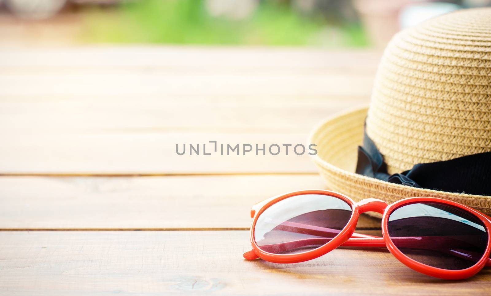 Hat and red sunglasses fashion on the wood by photobyphotoboy