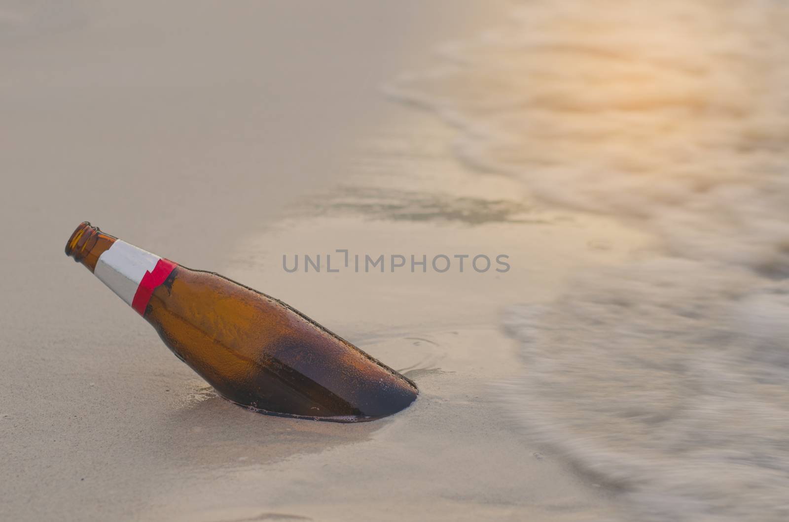 Bottles are left on the beach and become garbage.