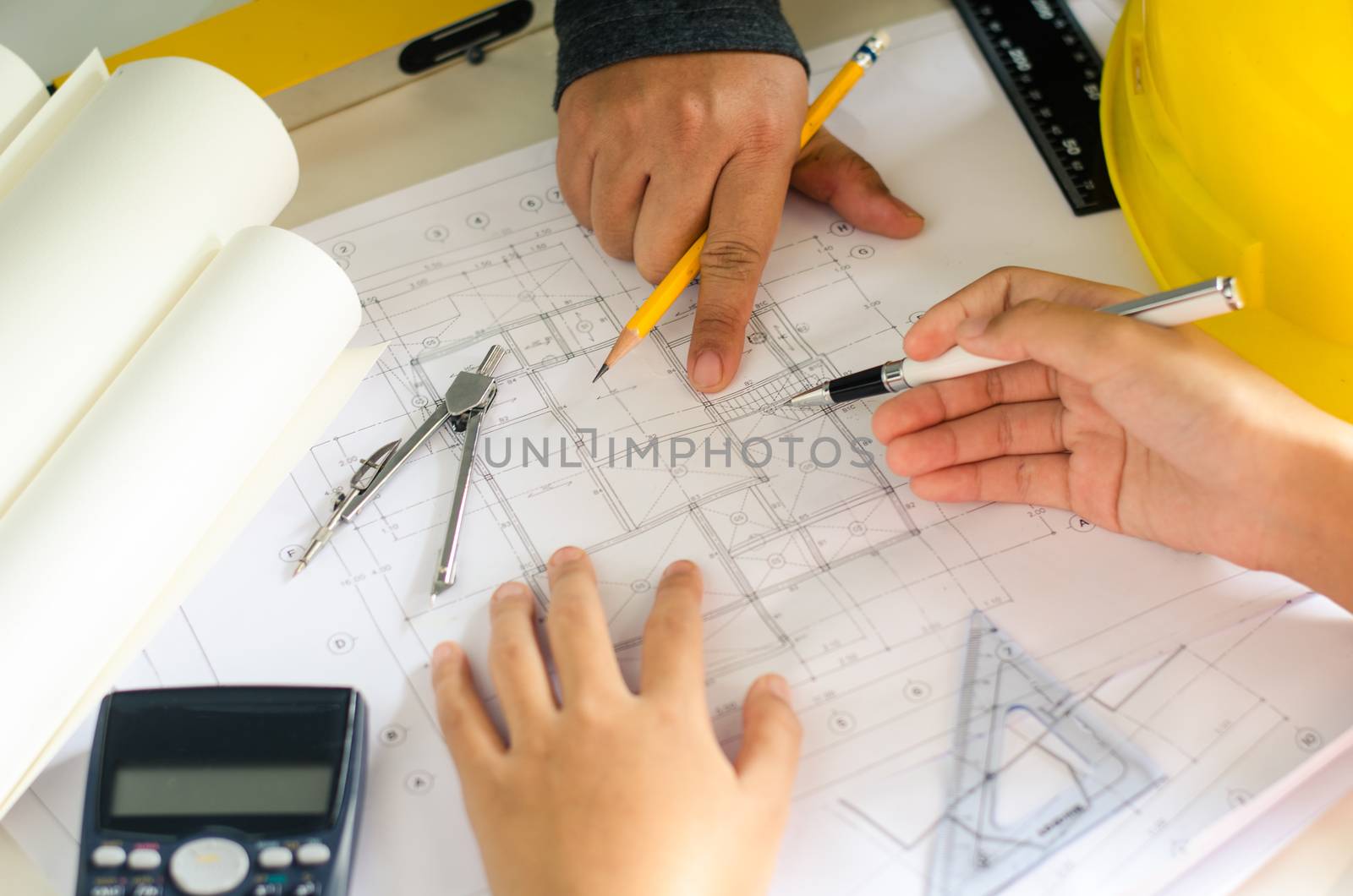 Engineering teams are meeting to present and discuss construction work designed and implemented.