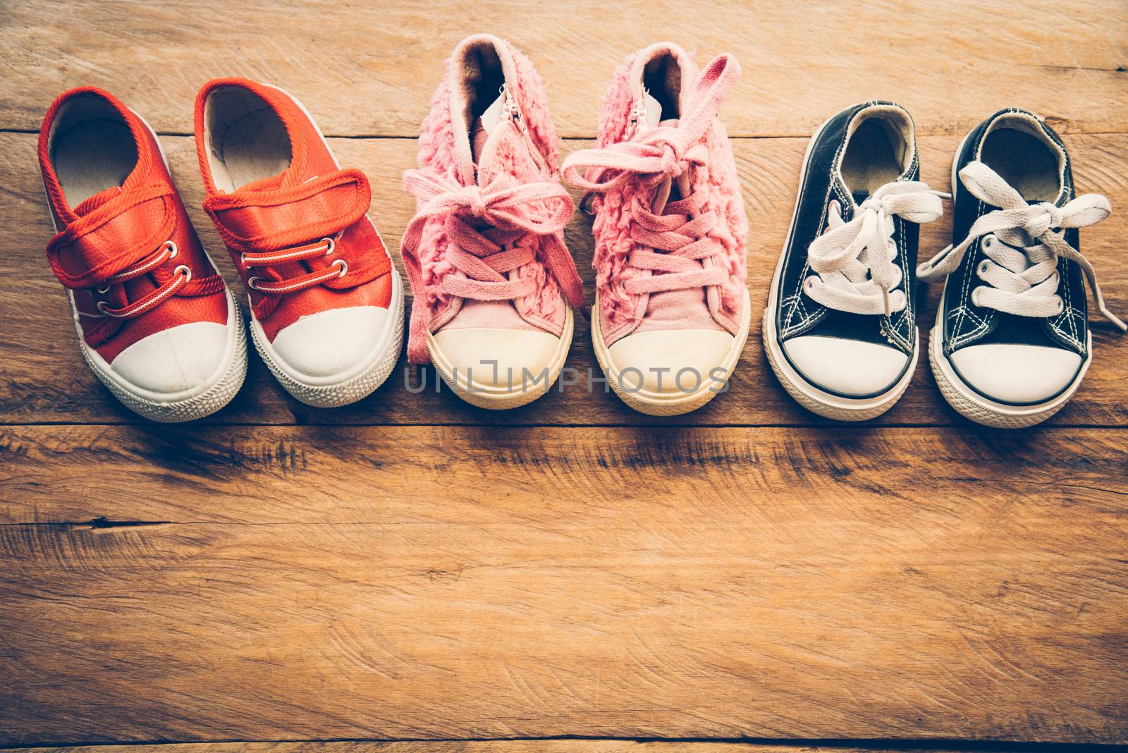 Shoes for children on wooden floor - lifestyle