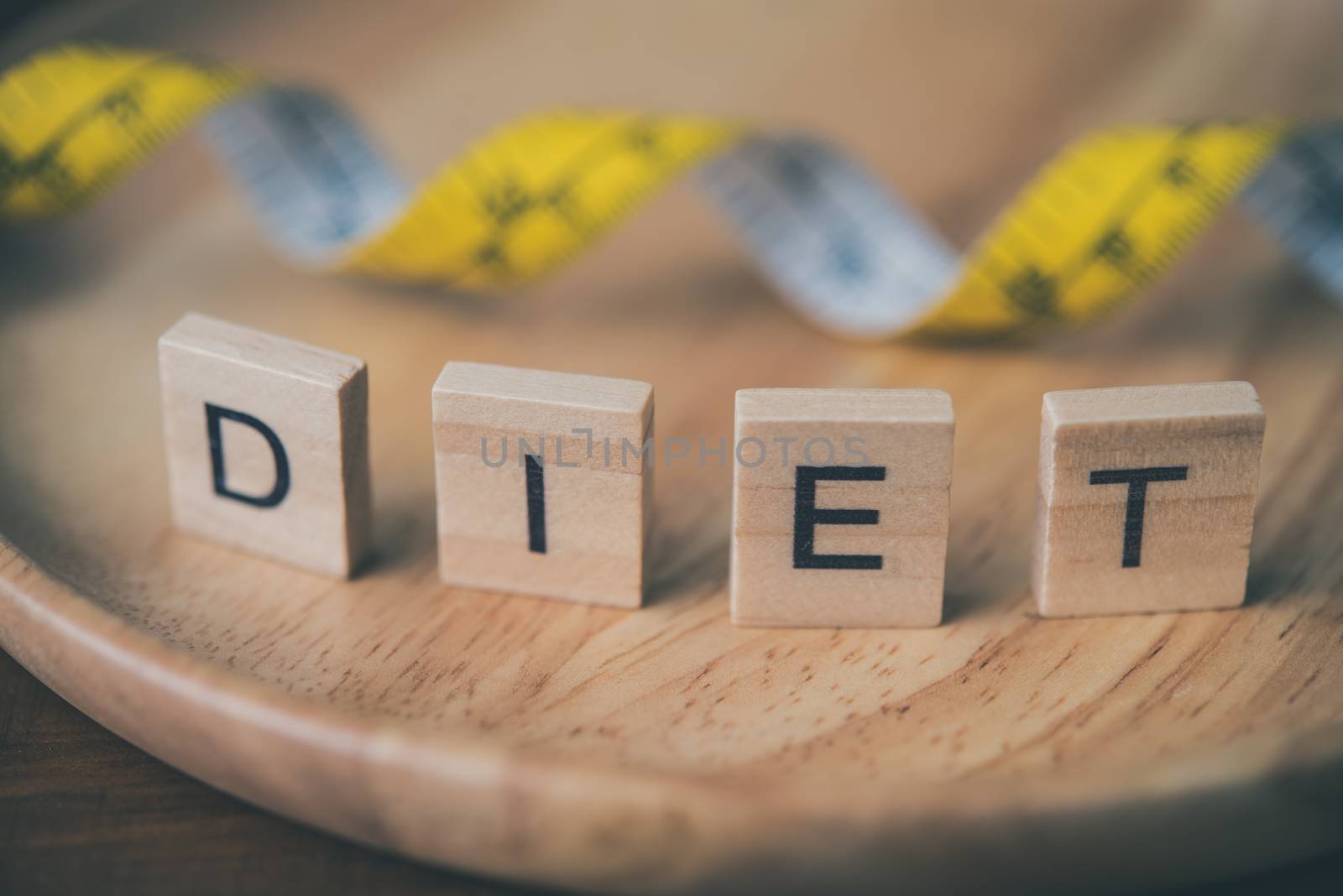 The concept of diet for weight loss and word " diet " in wooden place