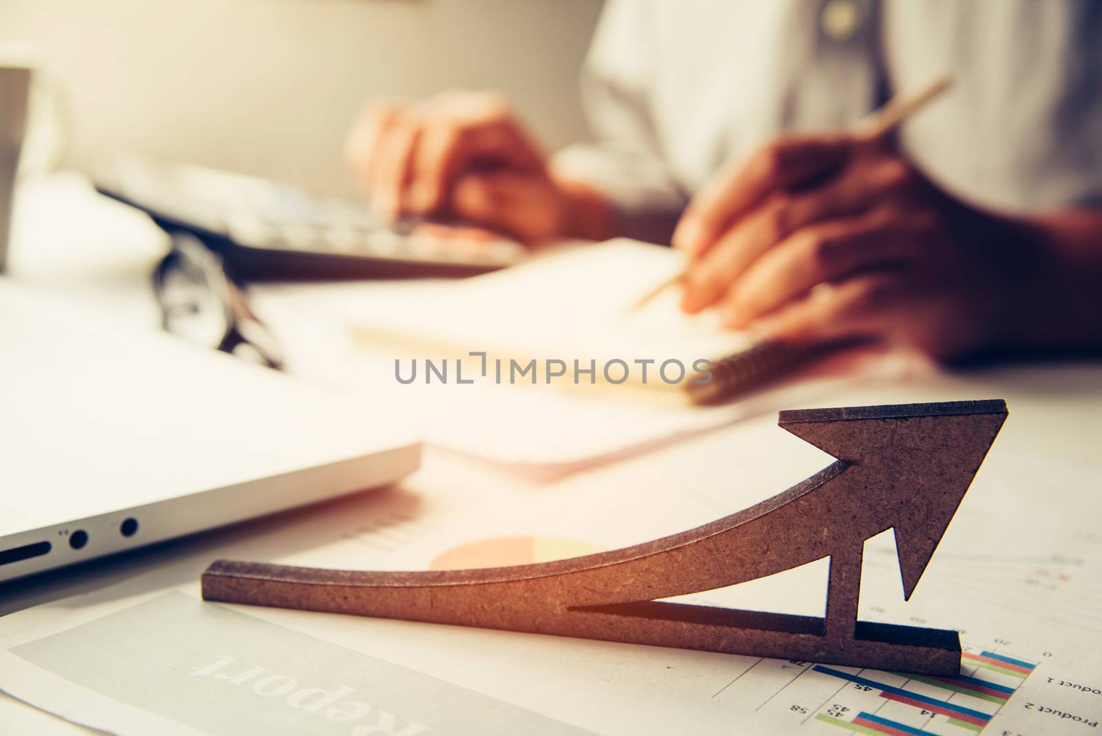 Business metric focus icon There are business people working with laptop background 