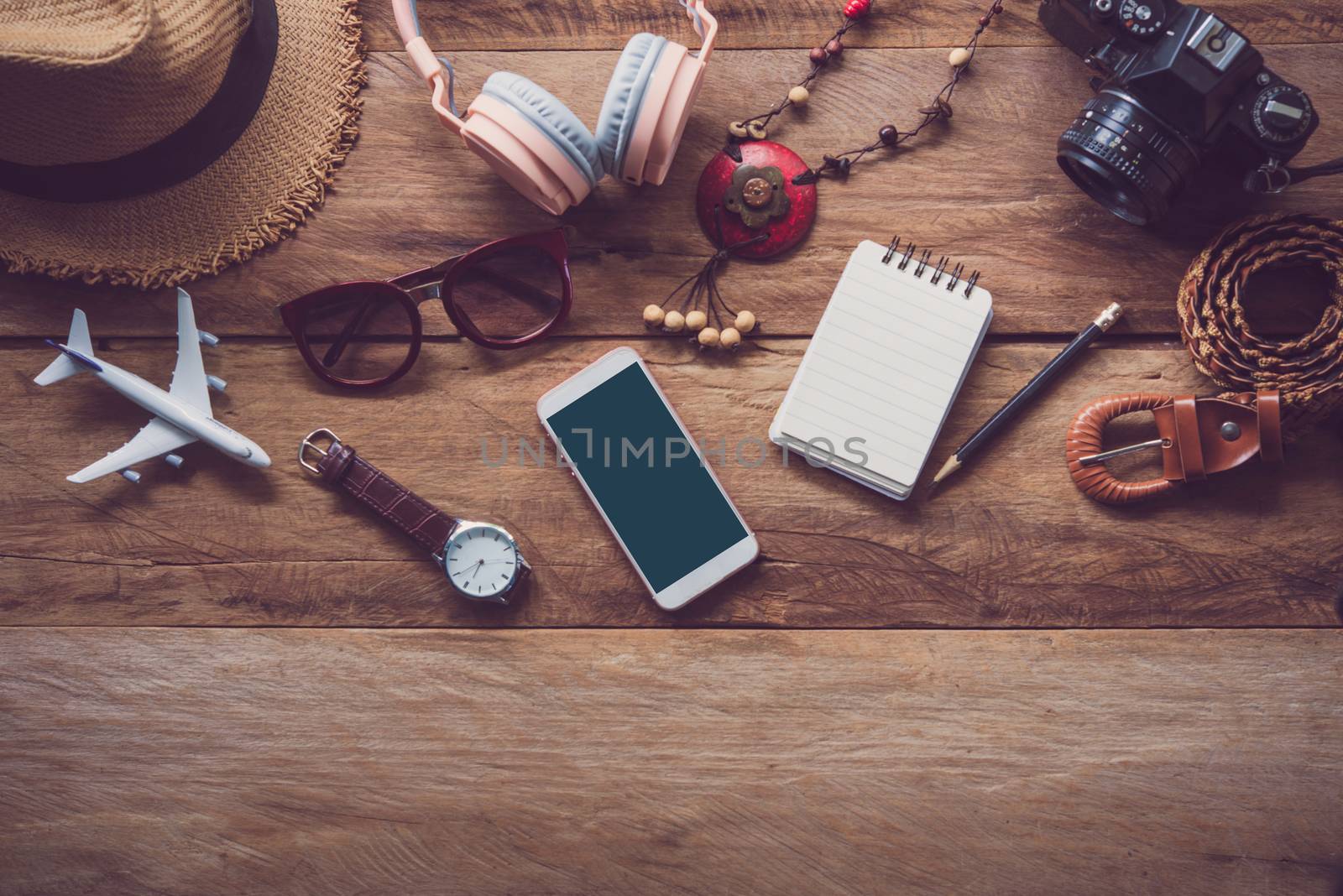 clothing for travel placed on a wooden floor for travel