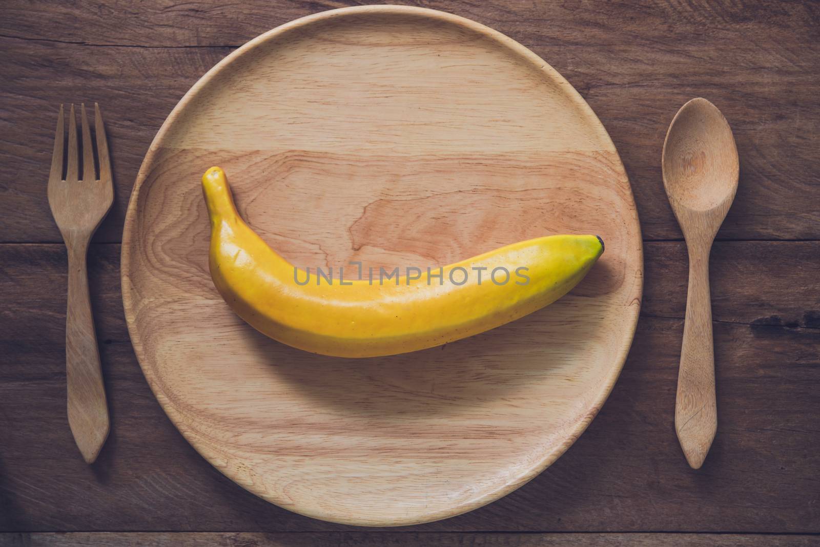 banana in wood plate concept diet
