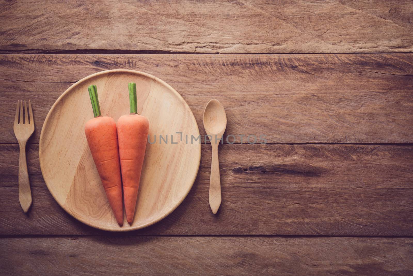 Carrot in wood plate concept diet