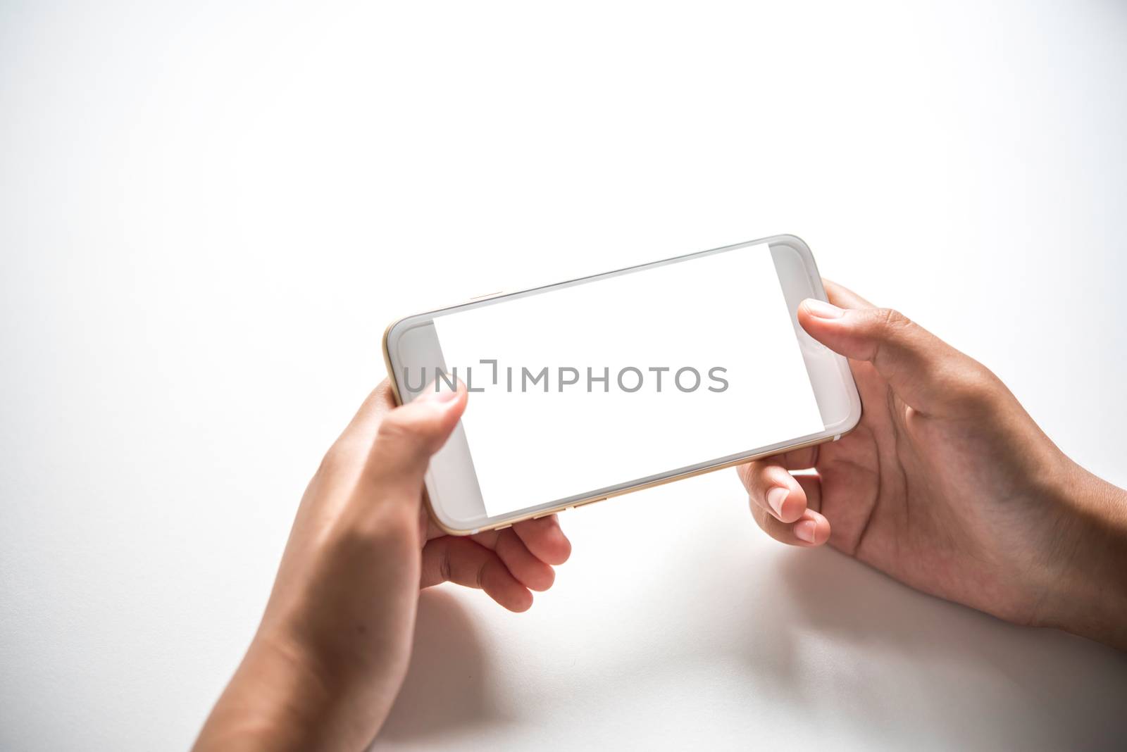 Hand holding smart phone isolated on white background