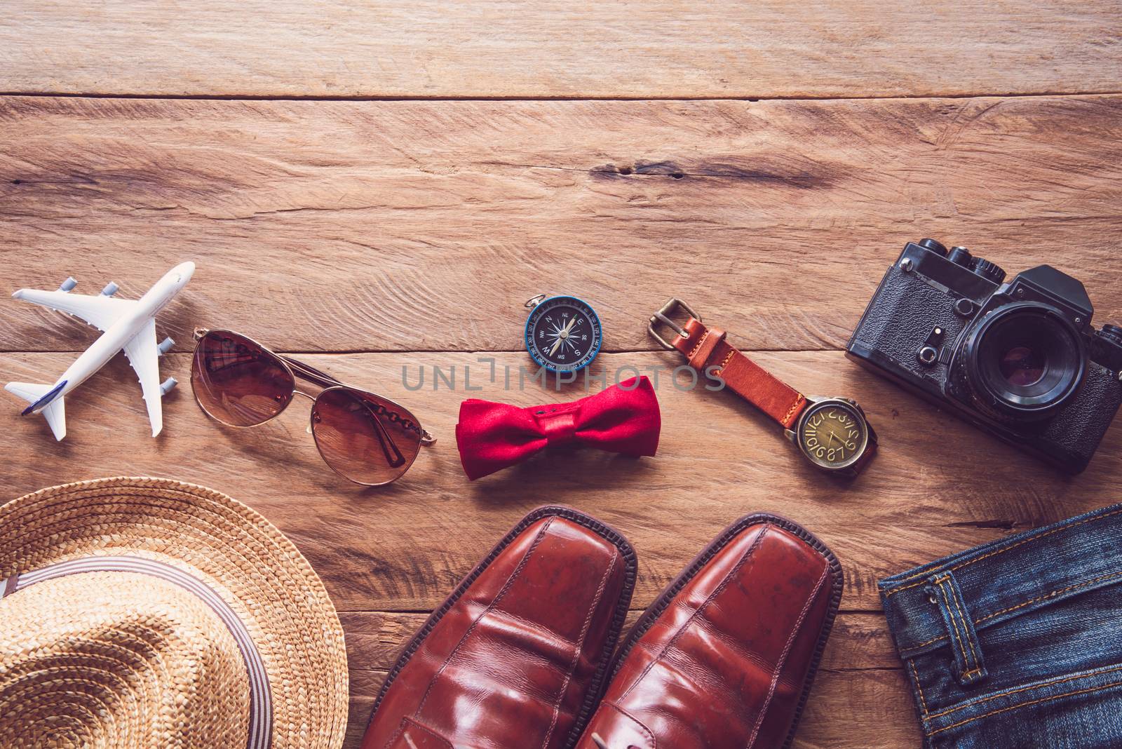 Travel Clothing accessories for men on wooden floor 
