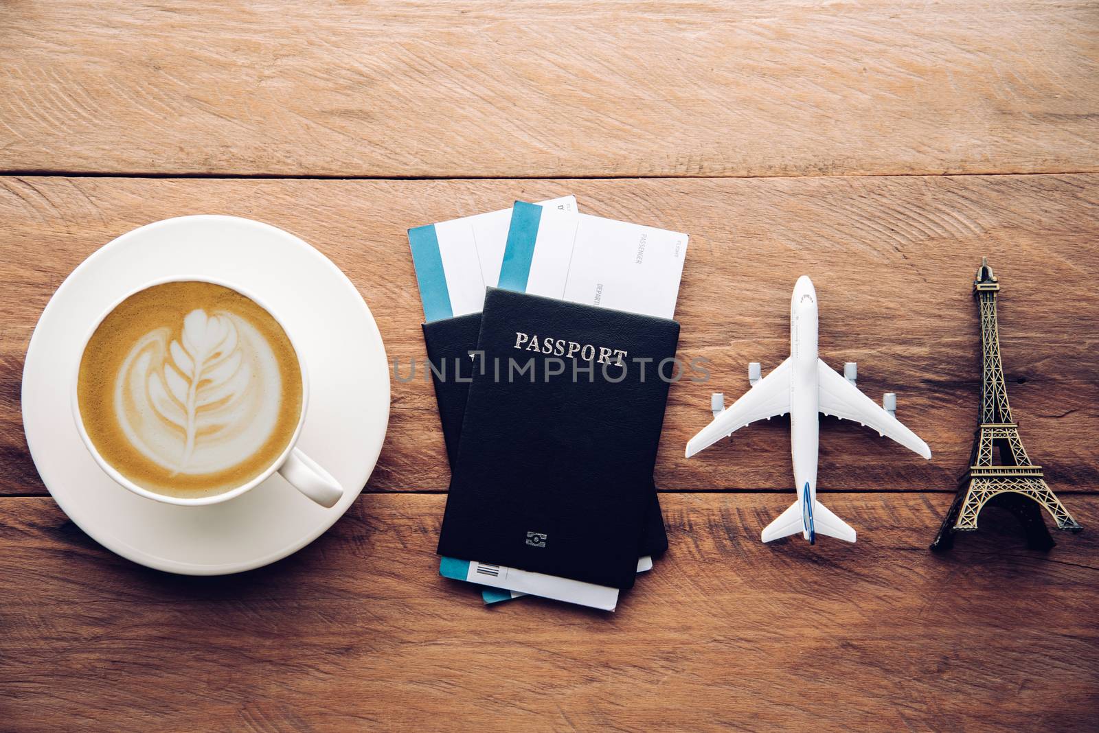 top view  passport and smartphone on wooden table, for travel concept