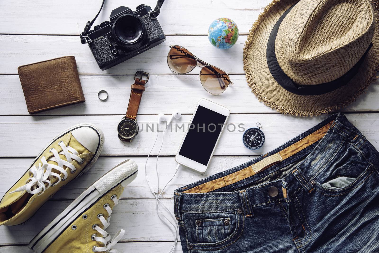 Travel accessories costumes. Passports, luggage, The cost of travel maps prepared for the trip, on white wooden floor