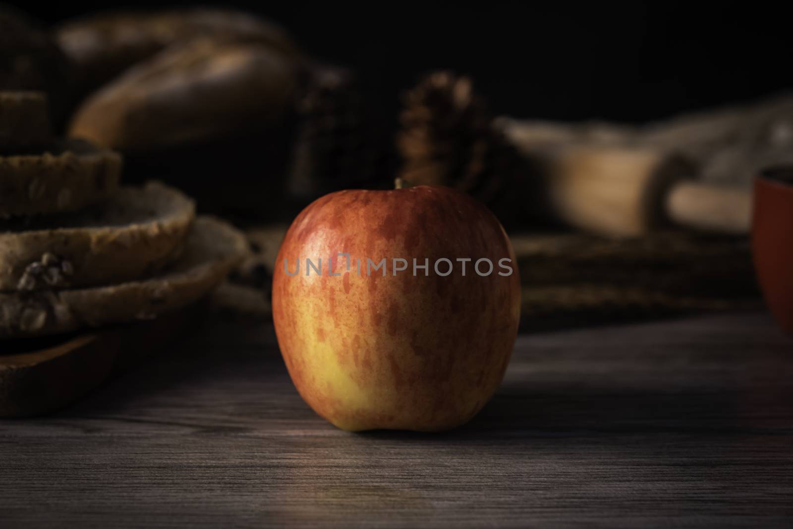 Red apples are laid on a wooden floor - concept lifestyle