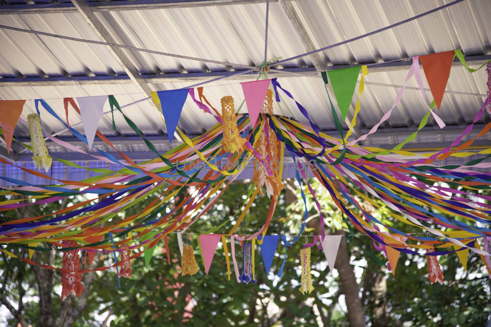 Colorful flags hanging in a beautiful line in the carnival.
