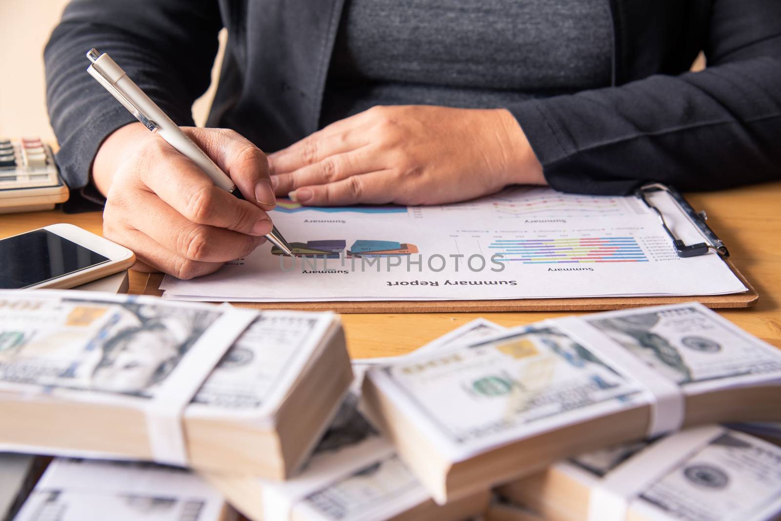 Businessmen are working on dollars, calculating profits and earning results, 