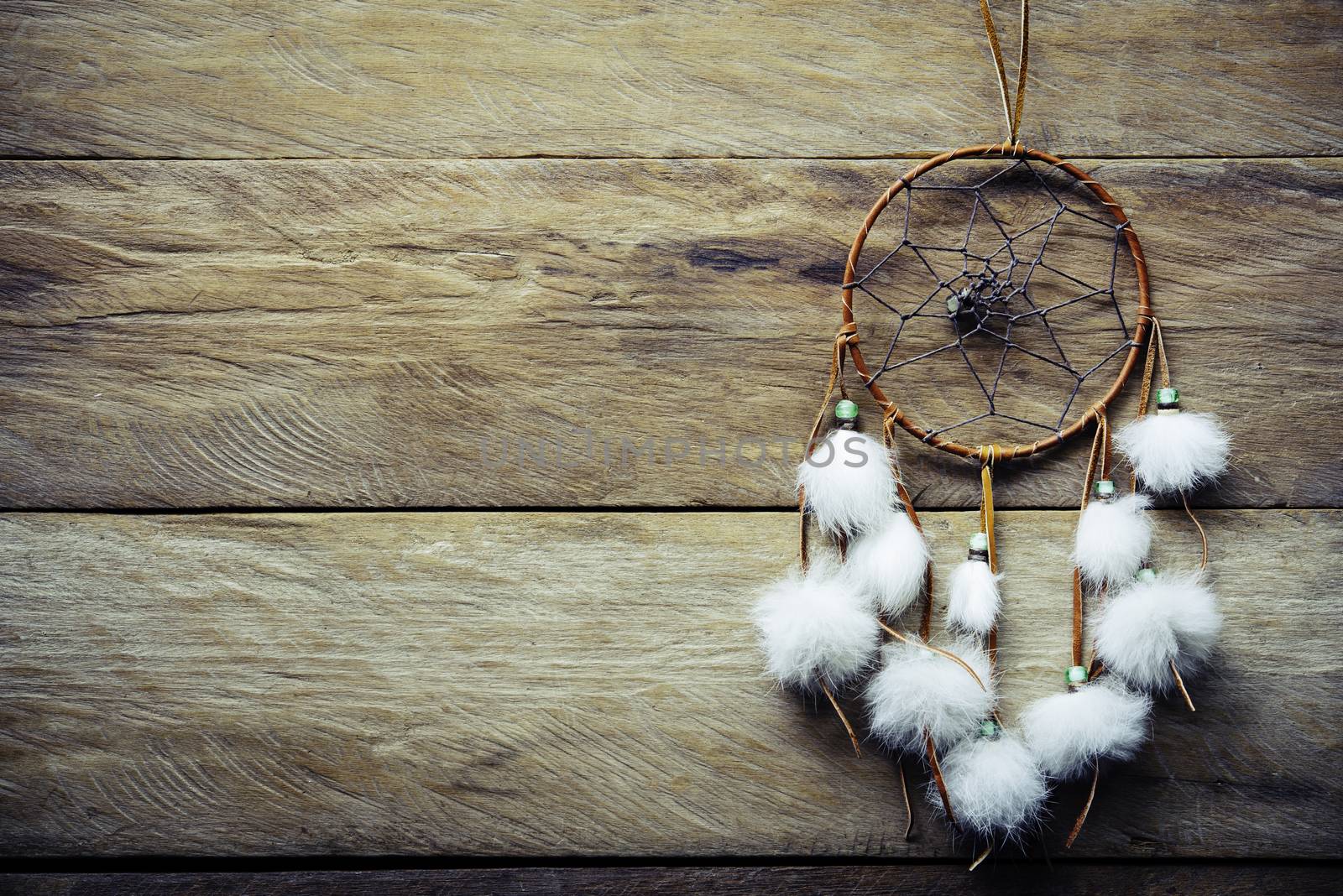 Dream catcher on wooden floor