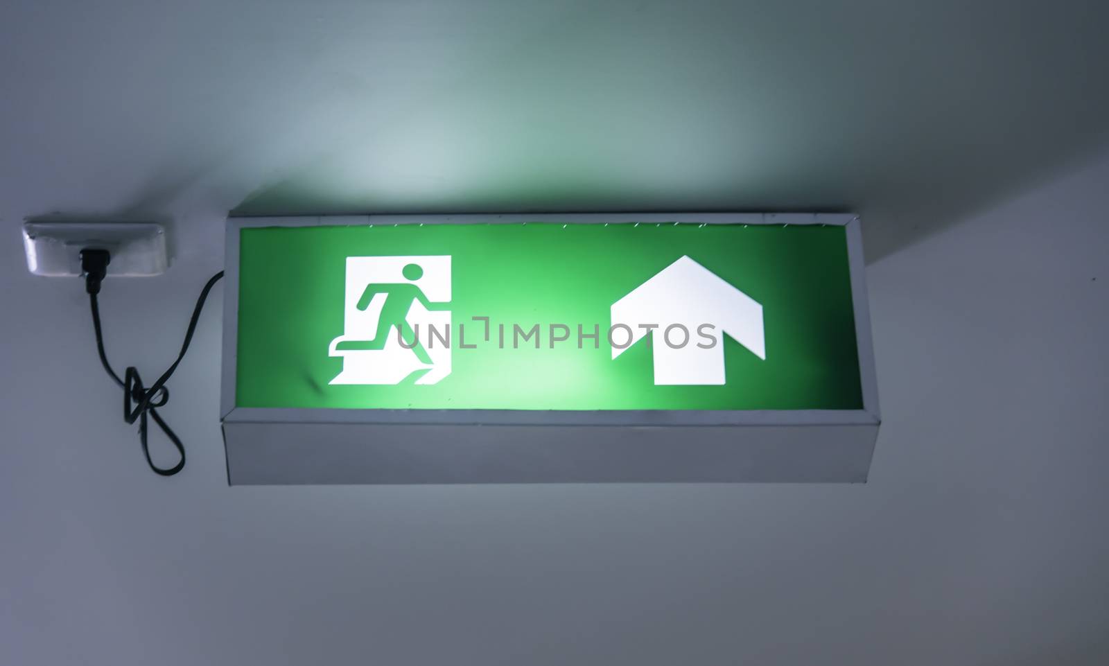 The emergency exit sign shows the way out.
