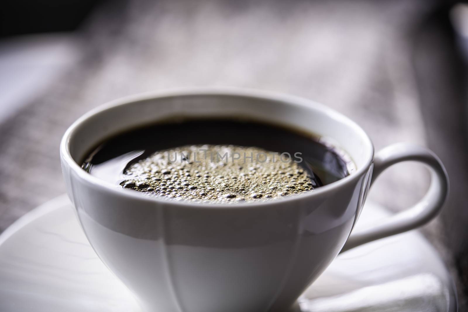 Coffee mug on wooden floor