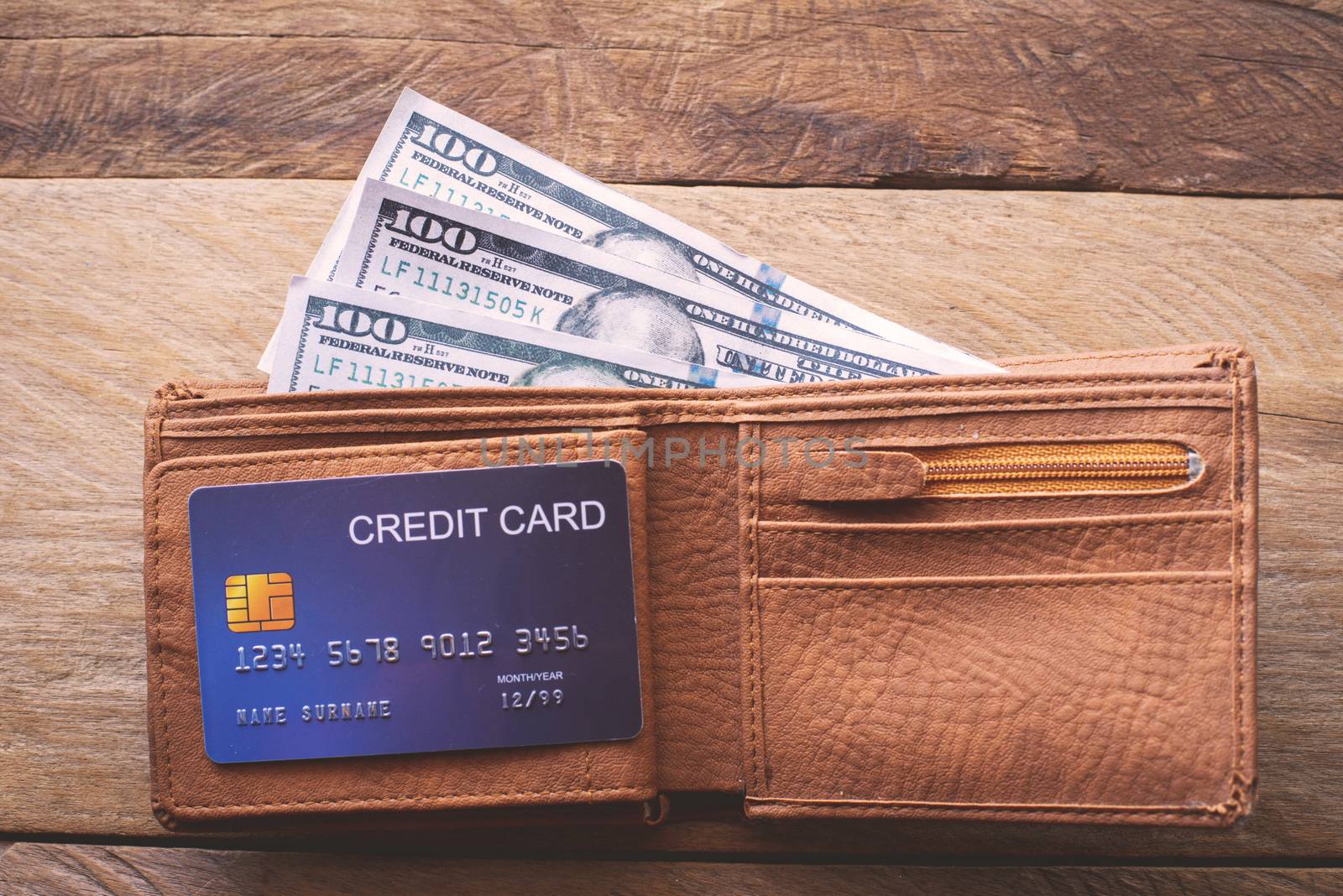 The purse and the dollar and the credit card are inside.