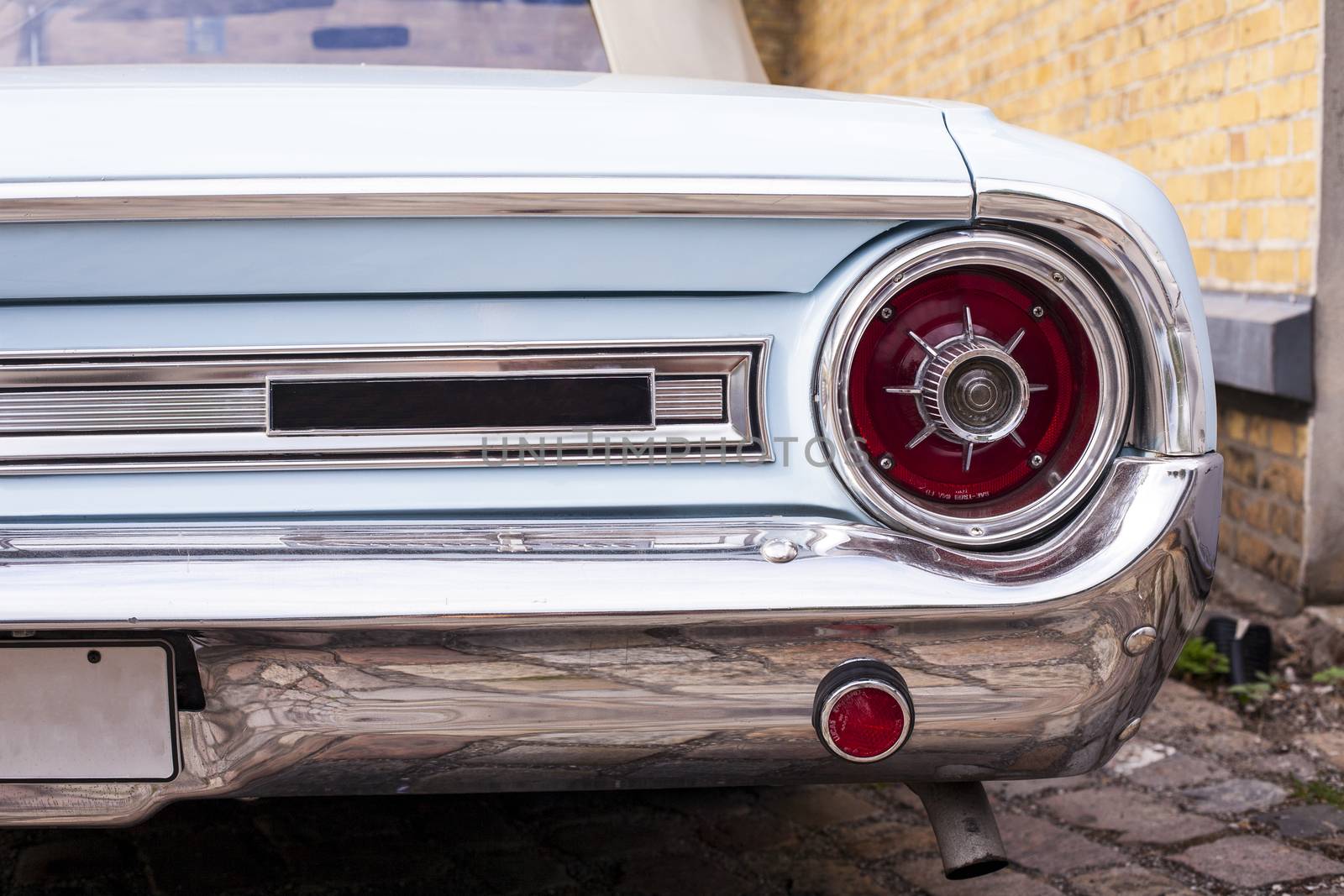 Classic vintage car. Close-up of headlights of luxurious vintage vehicle