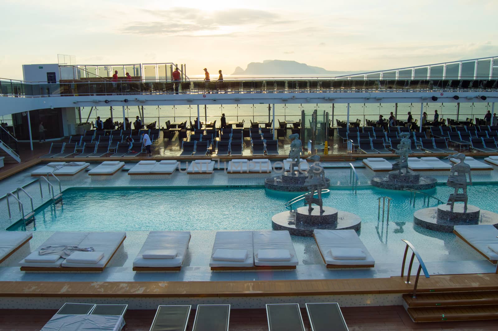 Outdoor deck with swimming pool, sun beds, video screen. CRUISE ship MSC Meraviglia, 8 October 2018