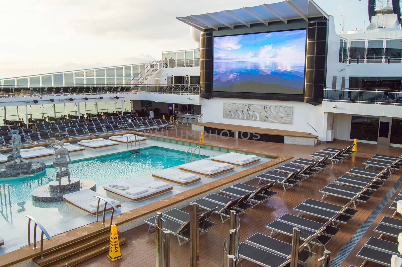 Outdoor deck with swimming pool, sun beds, video screen. CRUISE ship MSC Meraviglia, 8 October 2018. by claire_lucia