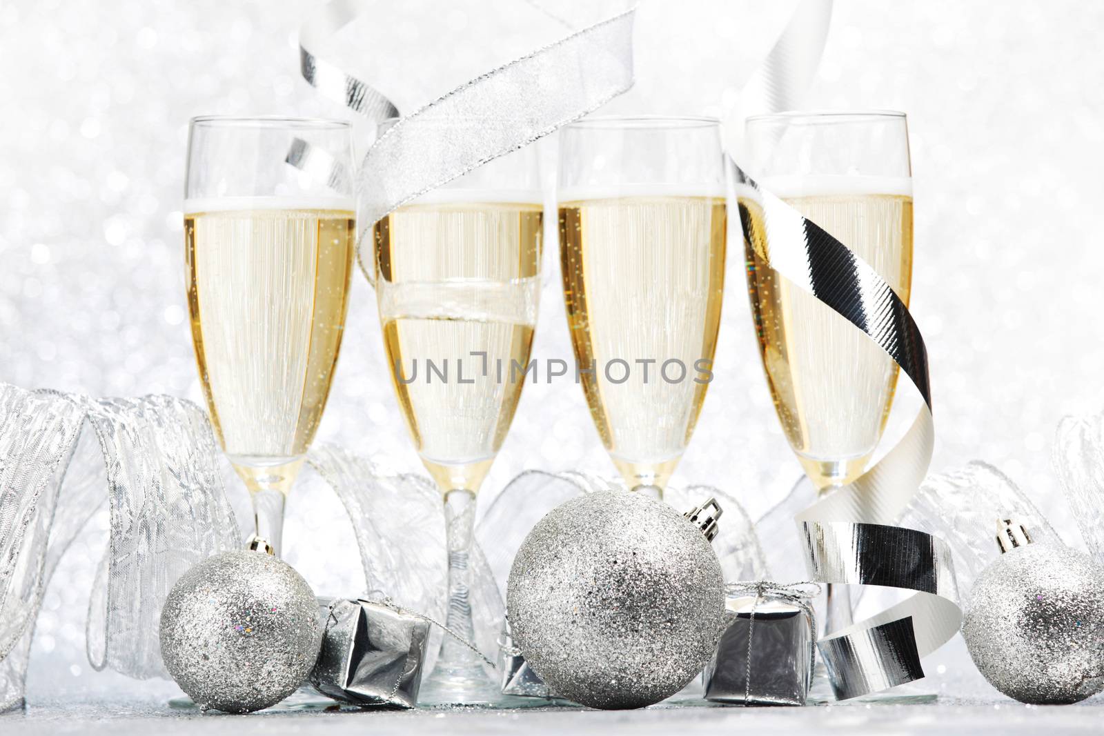 Champagne and decor on silver bokeh background