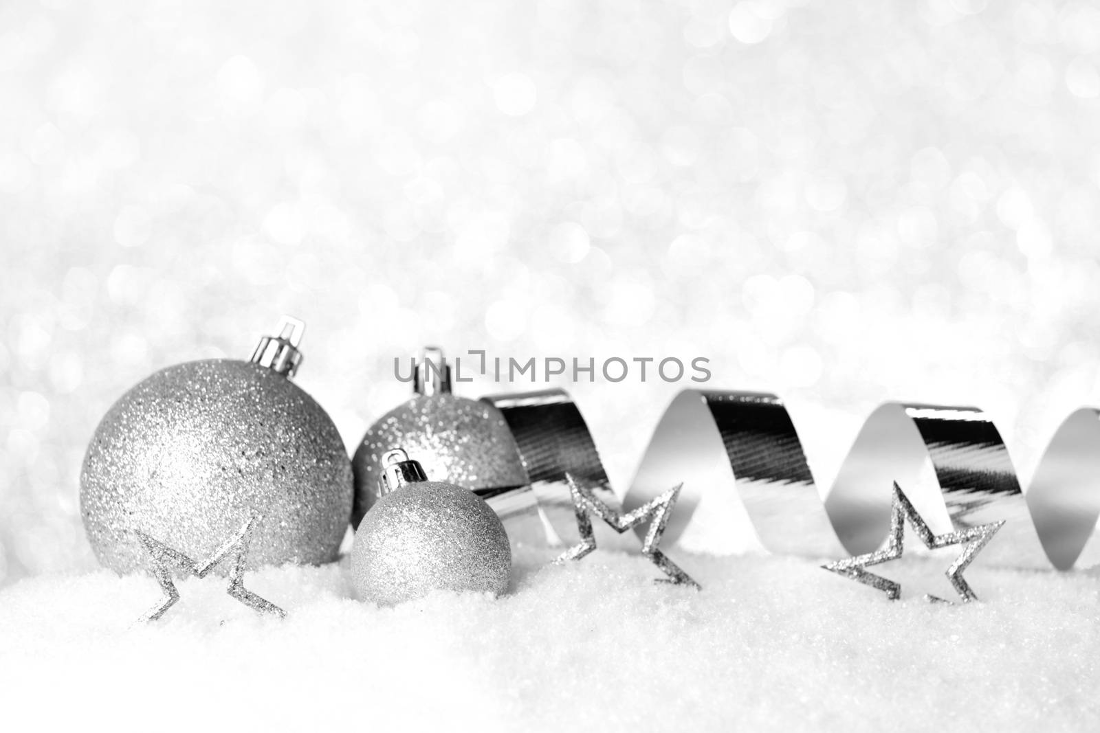 Christmas card with decorative baubles on snow