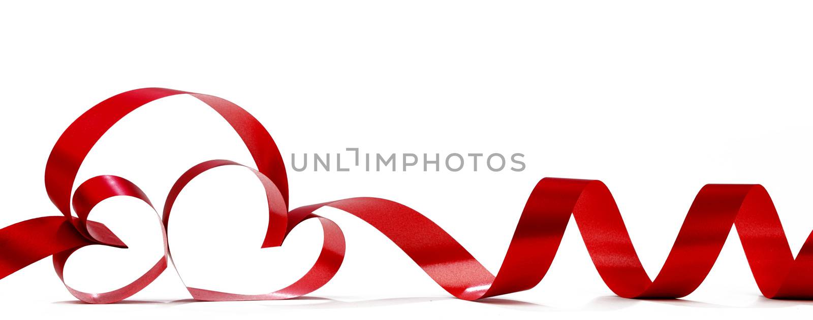 Hearts from red ribbon isolated on white background