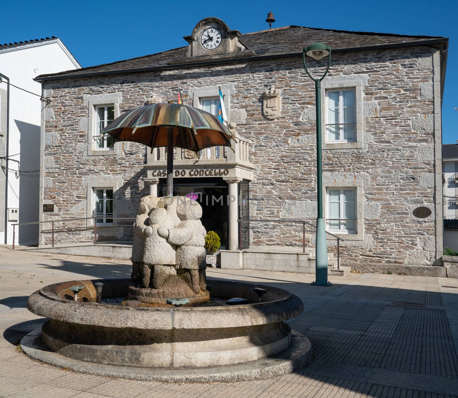 Historic townhall of Castroverde with children water well, Camino de Santiago trail, Calicia, Spain