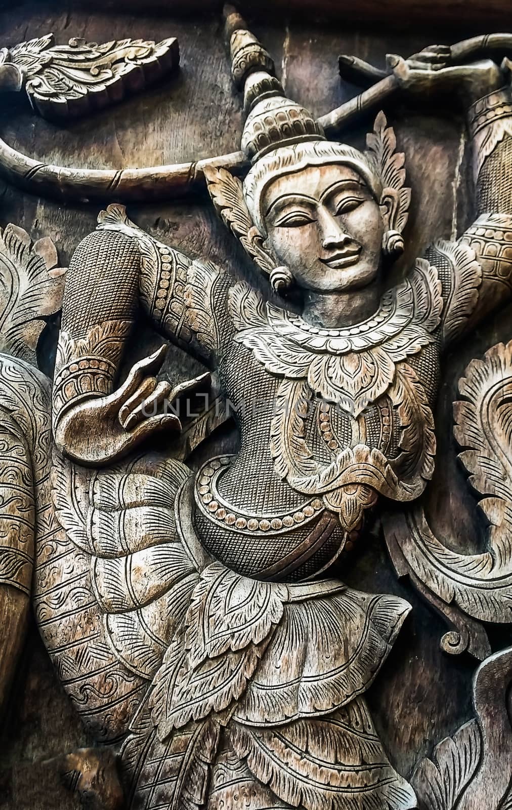 Closeup Wood carving Thai People in Literature