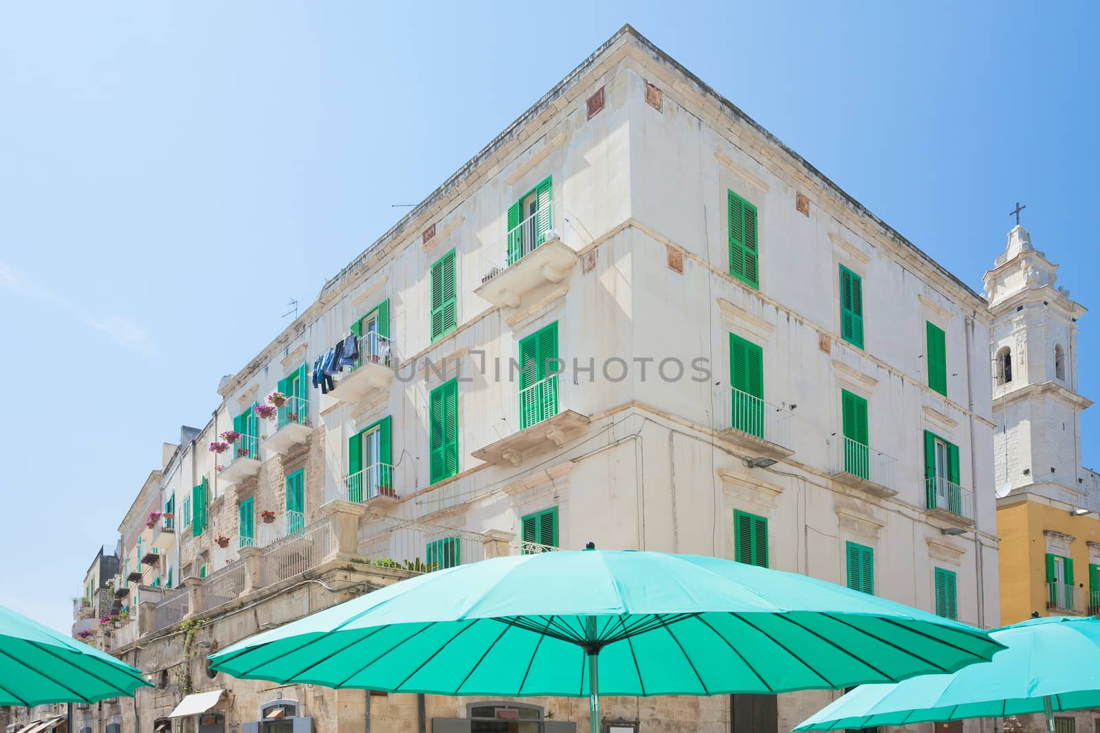 Molfetta, Apulia, Italy - Turquoise sunshades and lattice blinds in the streets of Molfetta