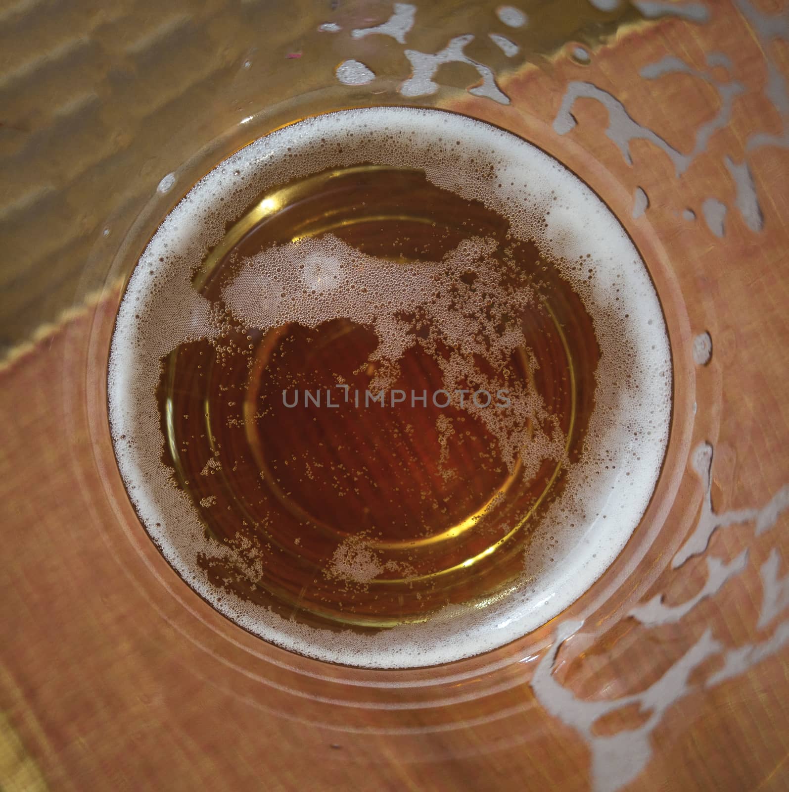 Inside of a glass of beer. by pippocarlot