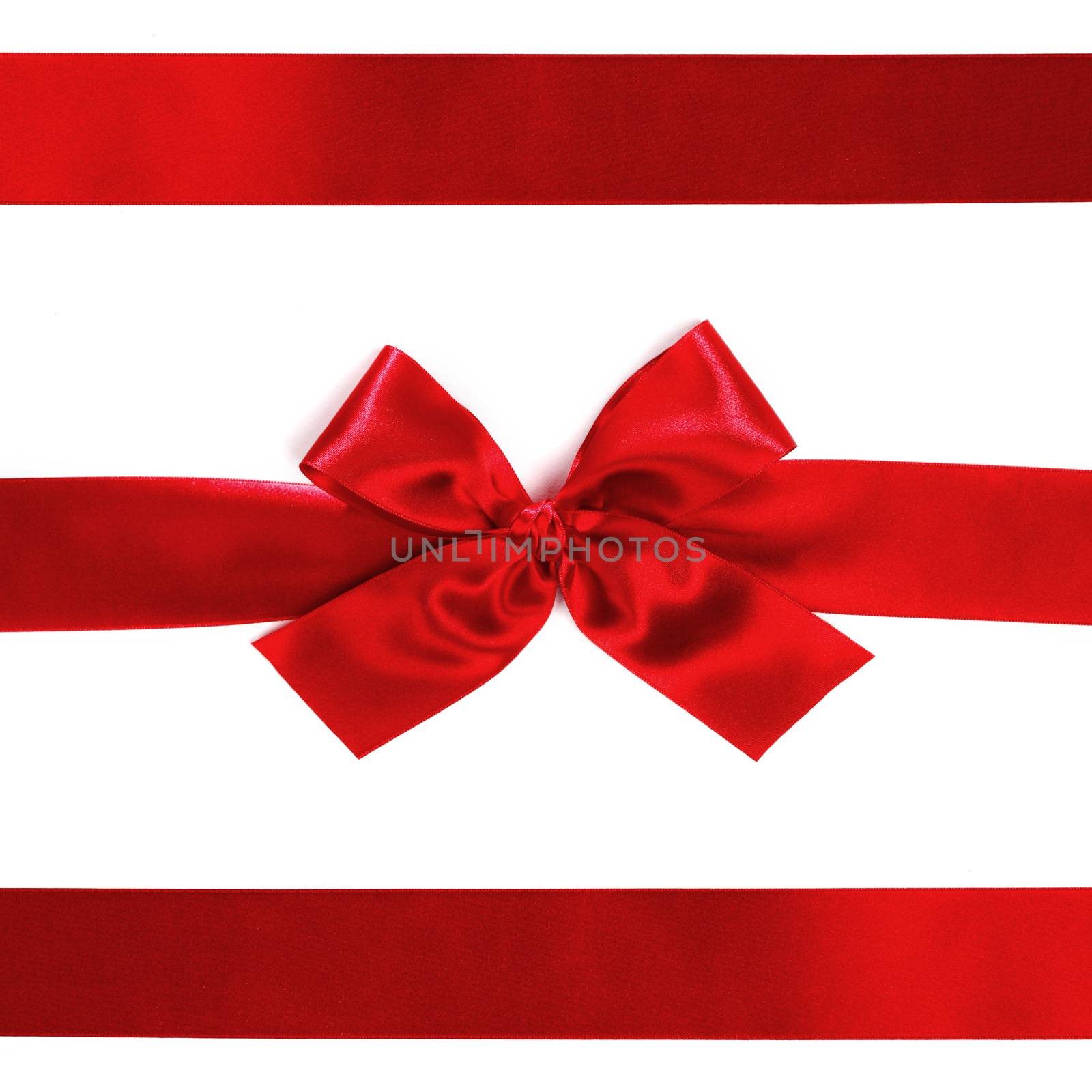 Shiny red satin ribbon decorative on white background