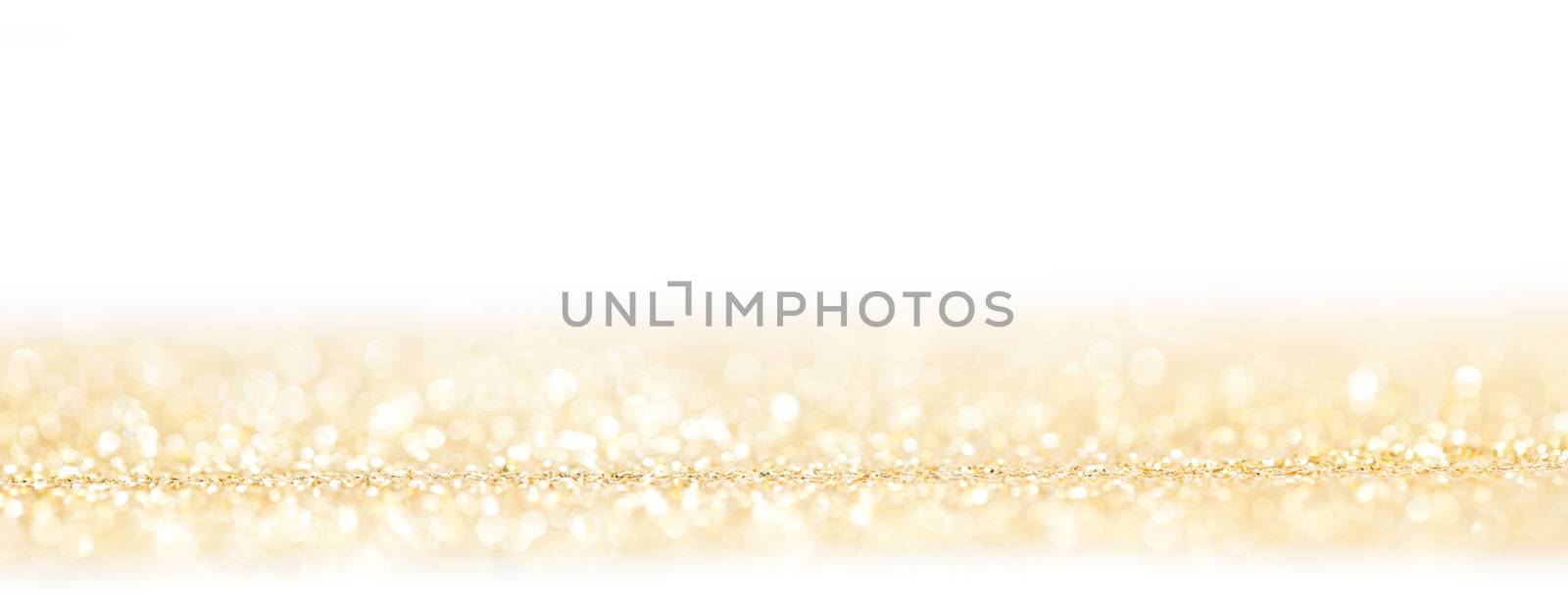 Golden decorative glitters on white background