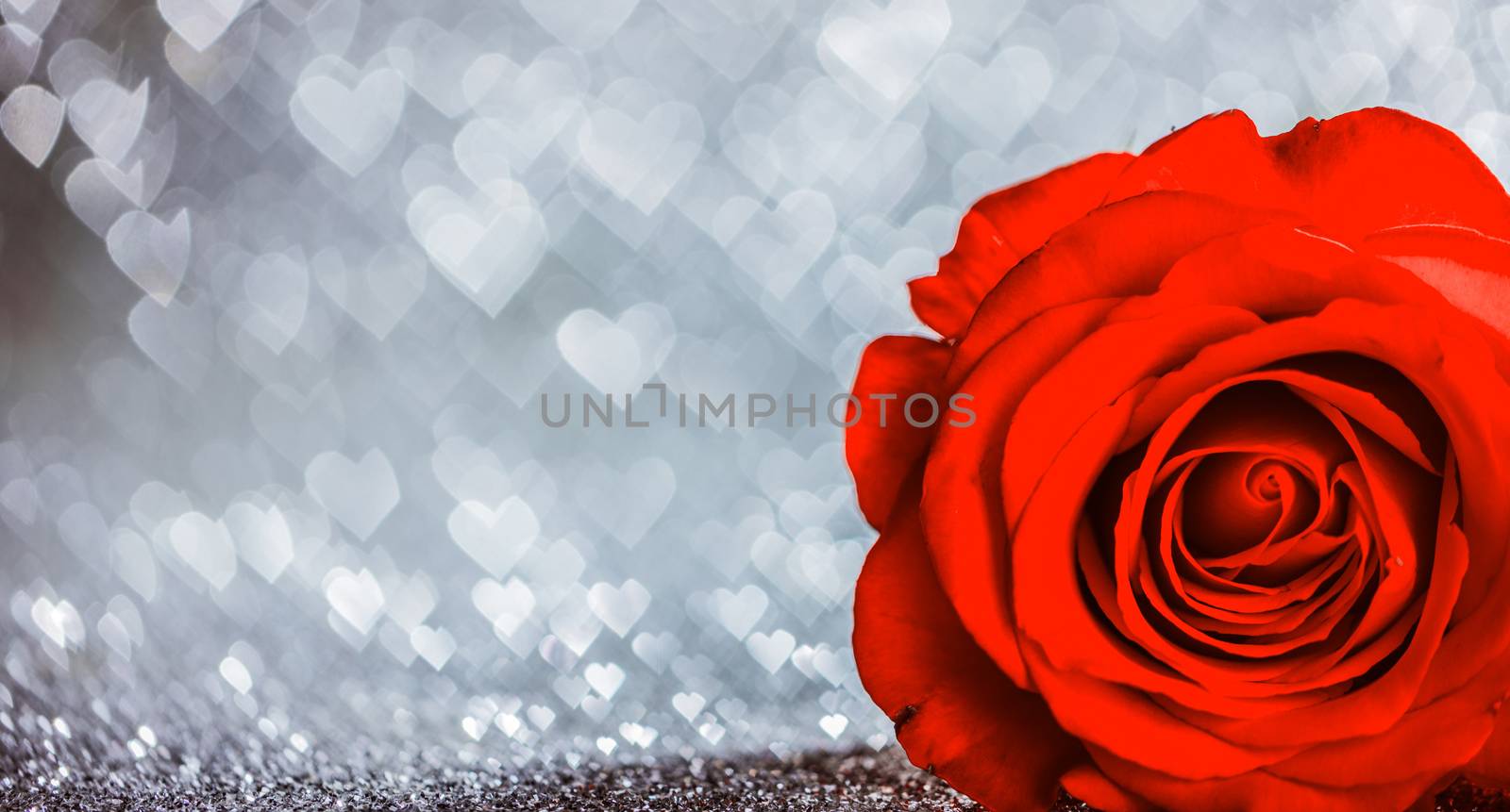 Beautiful red rose on heart shape bokeh glitter background