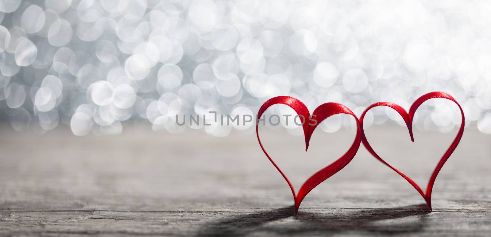 Two red ribbon hearts on wooden backround, Valentine day concept