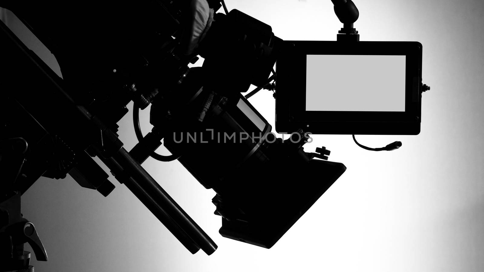 Silhouette images of video camera in tv commercial studio produc by gnepphoto