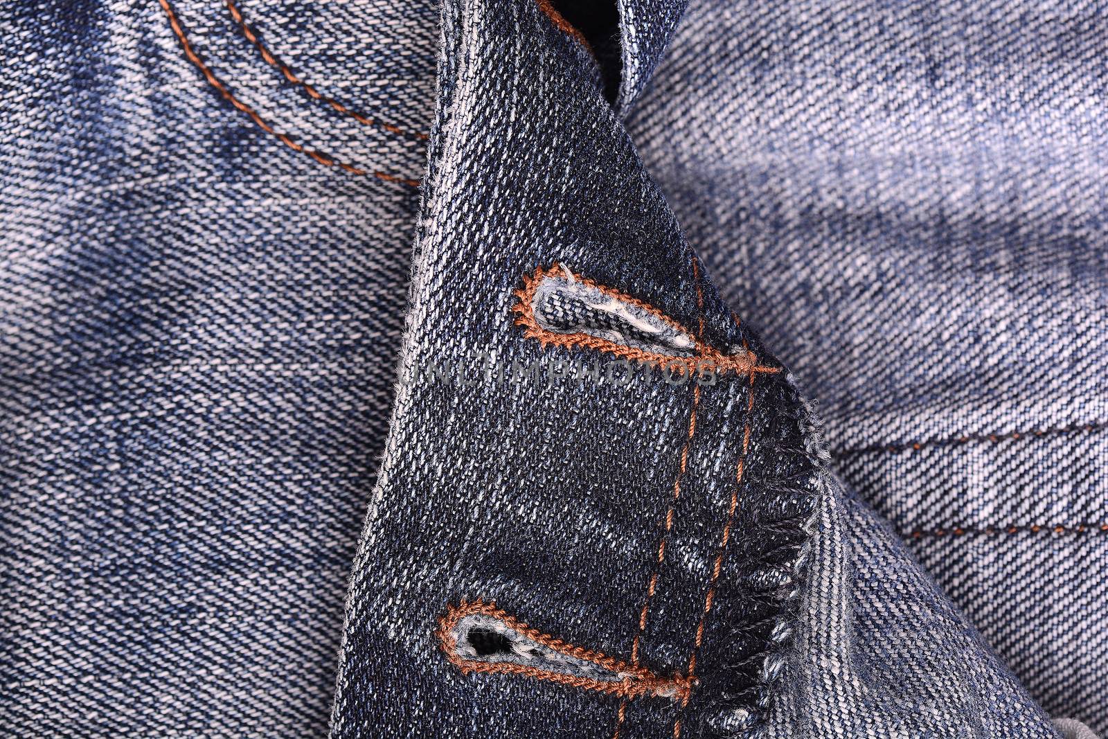 Dark blue jeans close up, denim cloth texture background