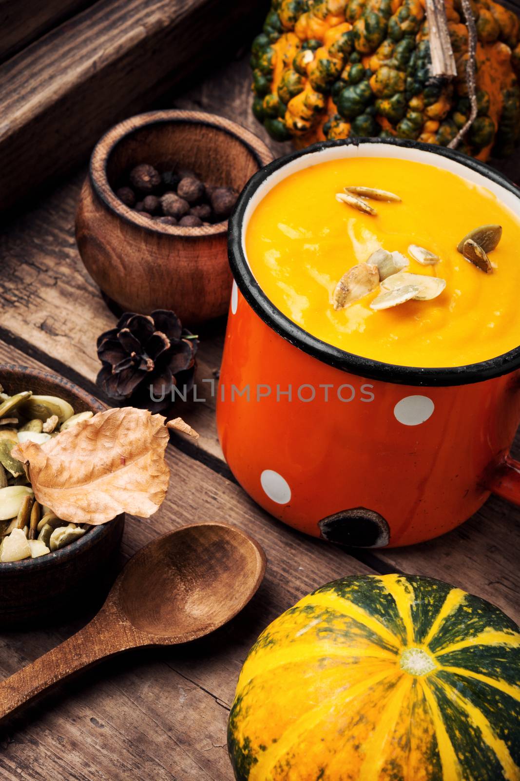 Autumn pumpkin soup in a metal cup. Autumn food
