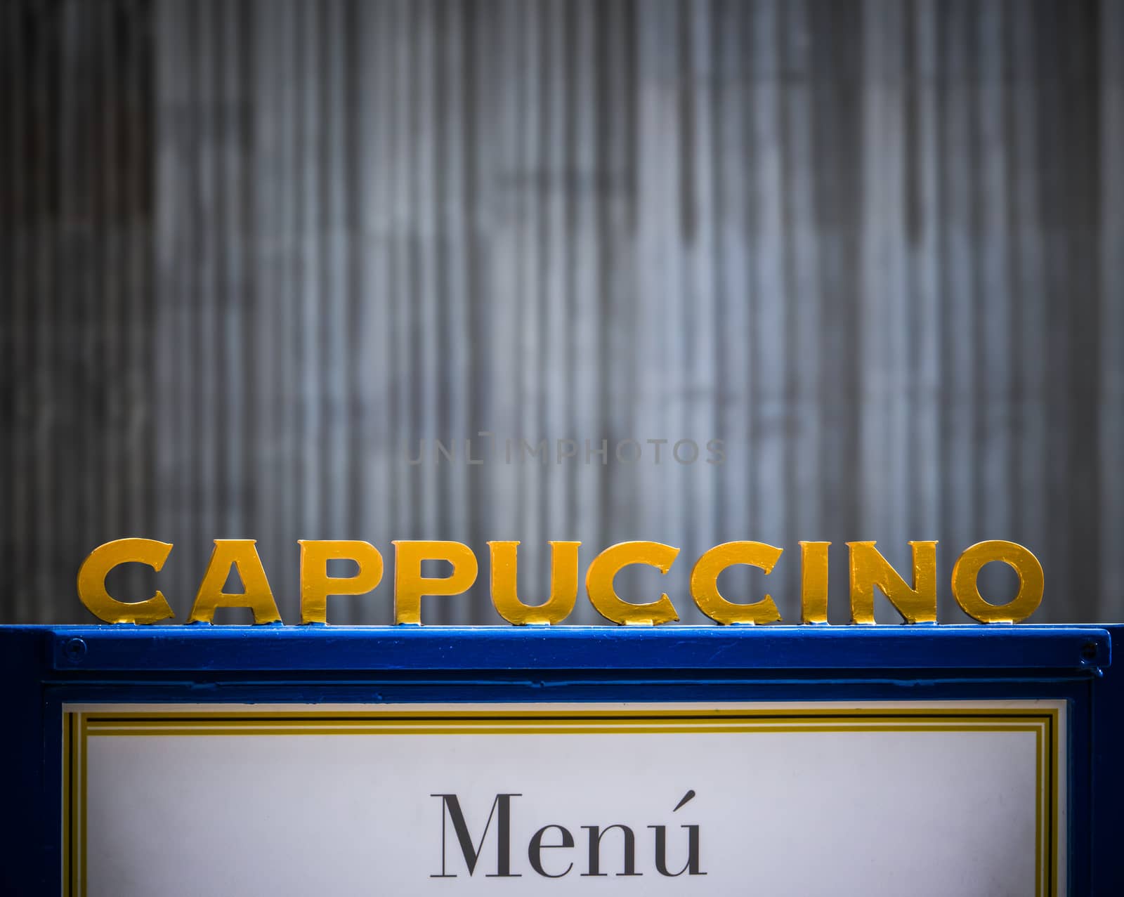 A Sign For Cappuccino At An Urban Coffee Shop With Copy Space