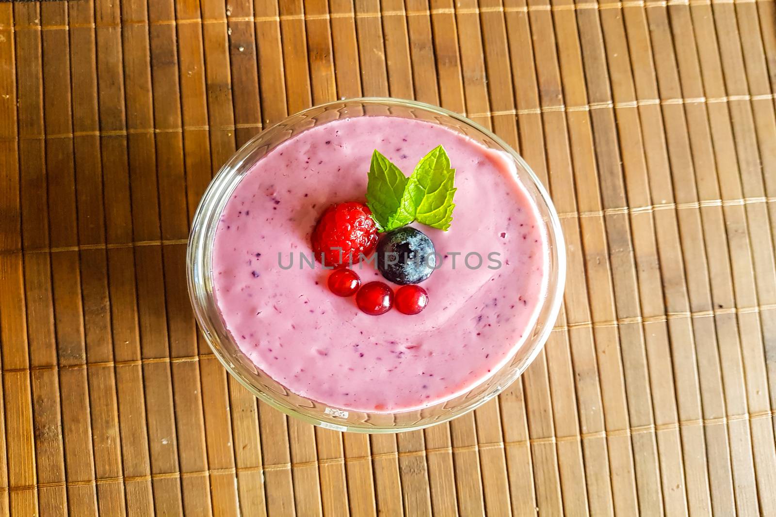 Low calorie food. Fresh healthy blueberries raspberries and redcurrants smoothie