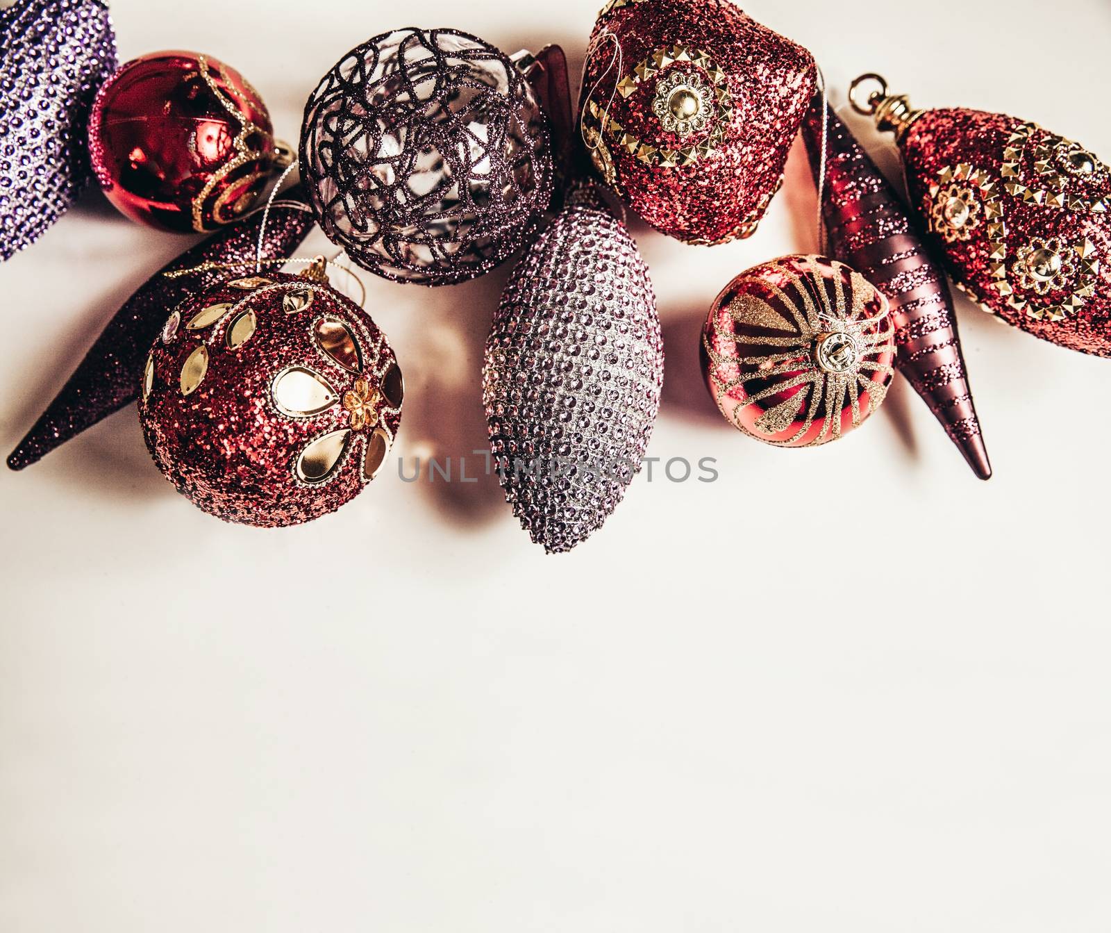 Top view of christmas decor set in red,crimson,pink and lilac colors