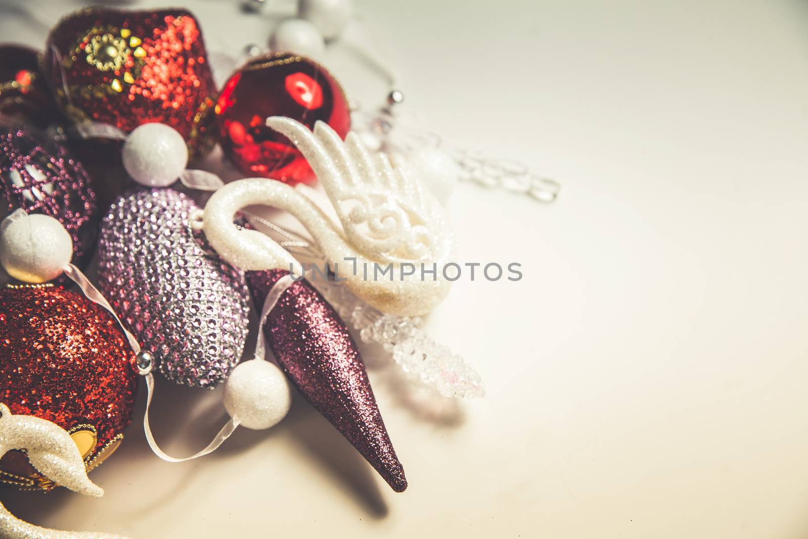 Top view of christmas decor set in red,crimson,pink and lilac colors