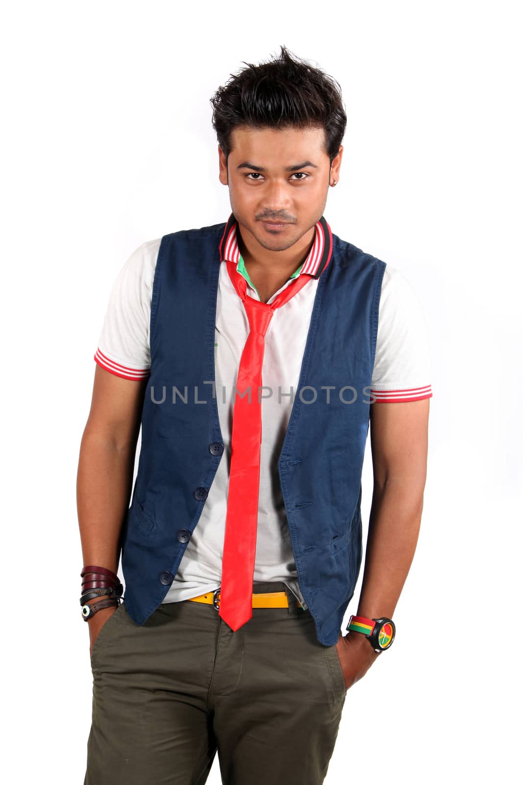 A Handsome young Indian guy posing on a white studio background