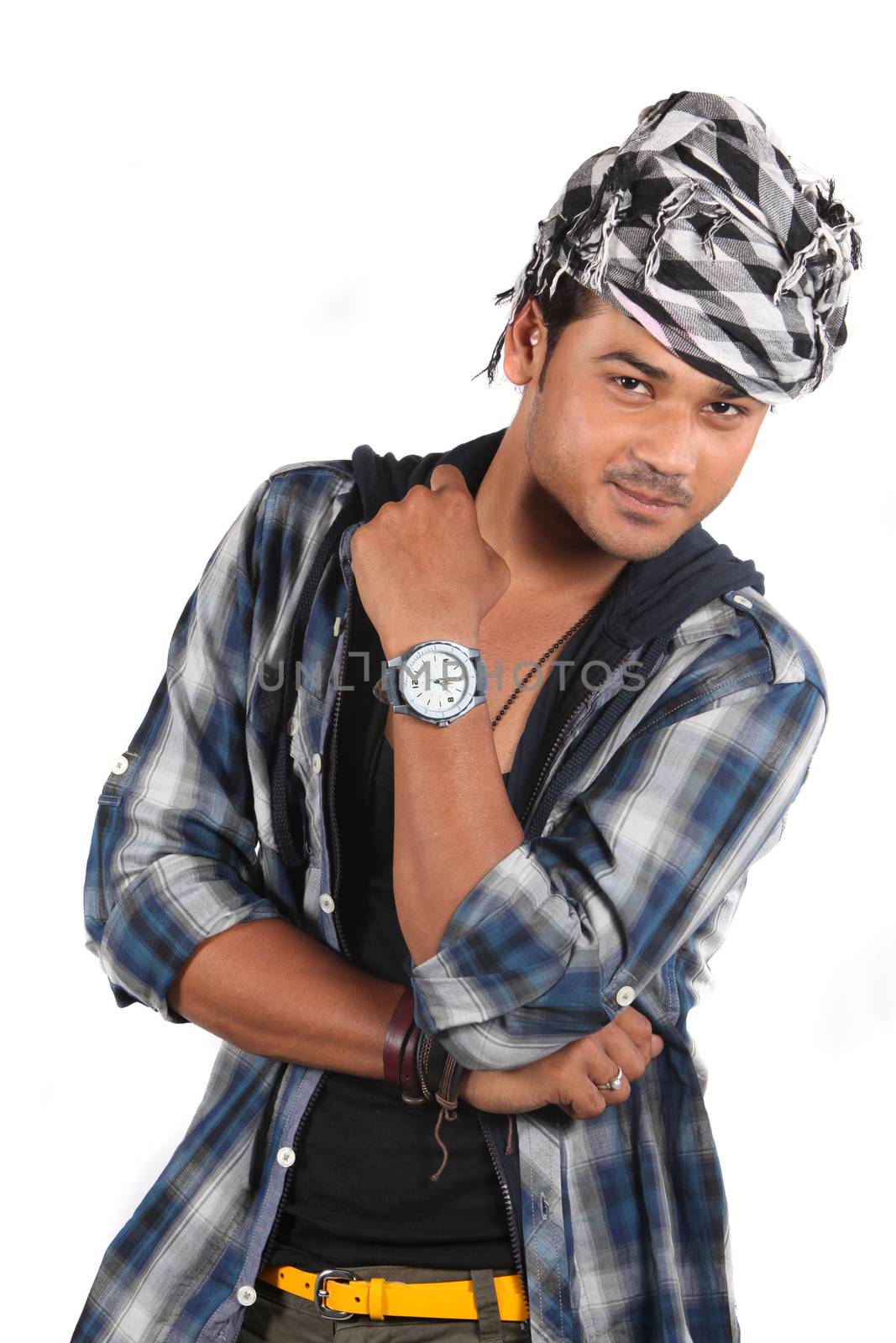 A young stylish Indian model posing in front of a white studio background.