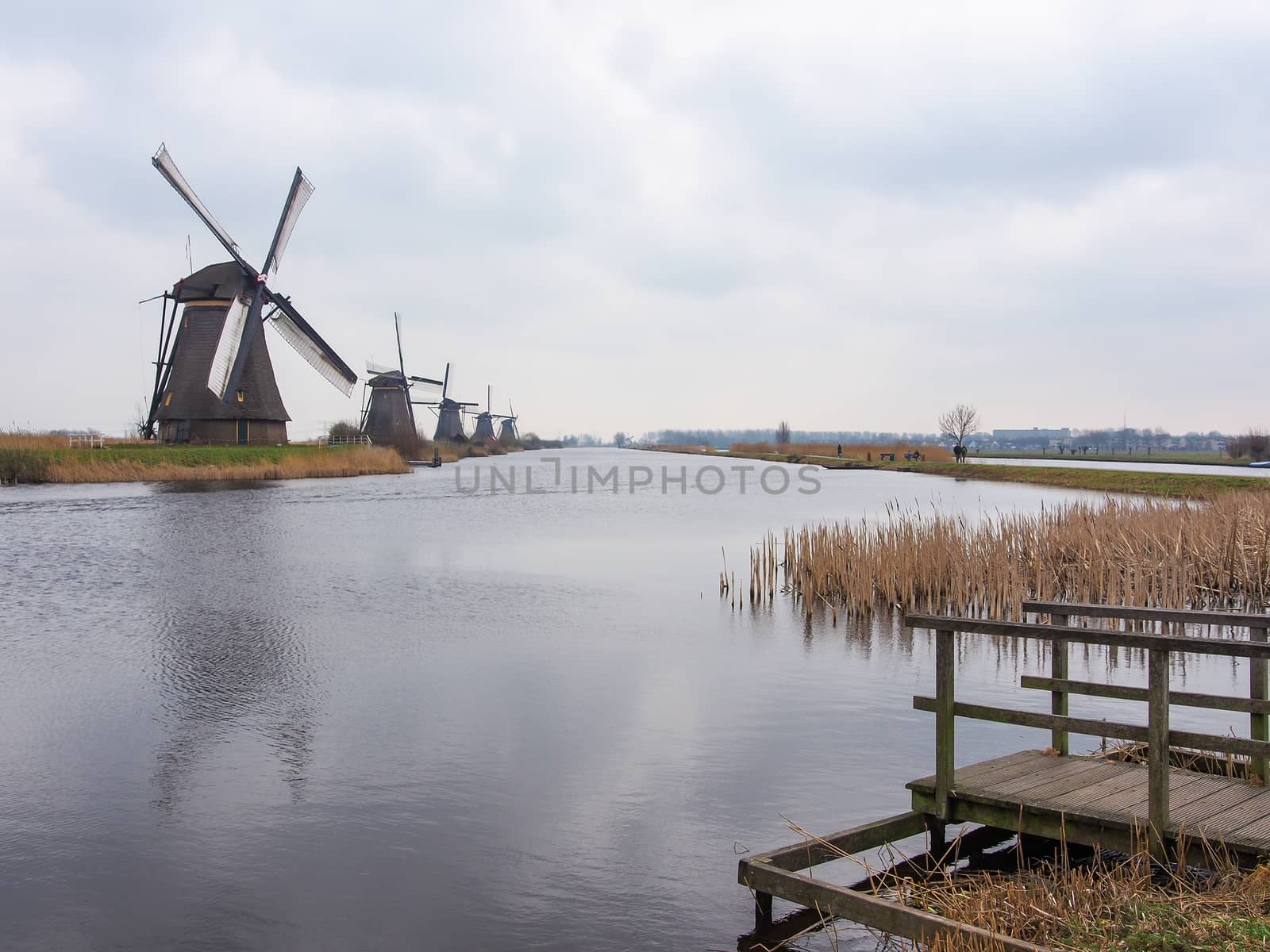 Netherlands rural landscape with windmills and canal by simpleBE